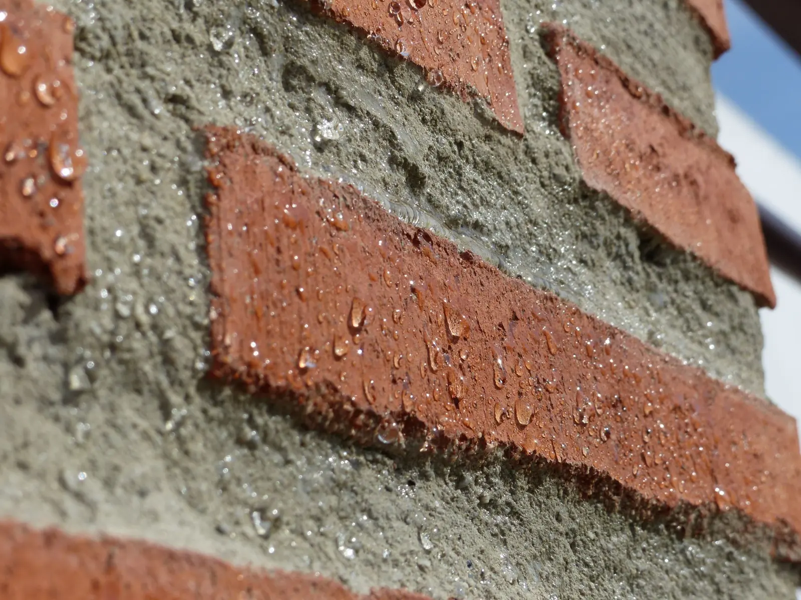 Water droplets beading on treated brick