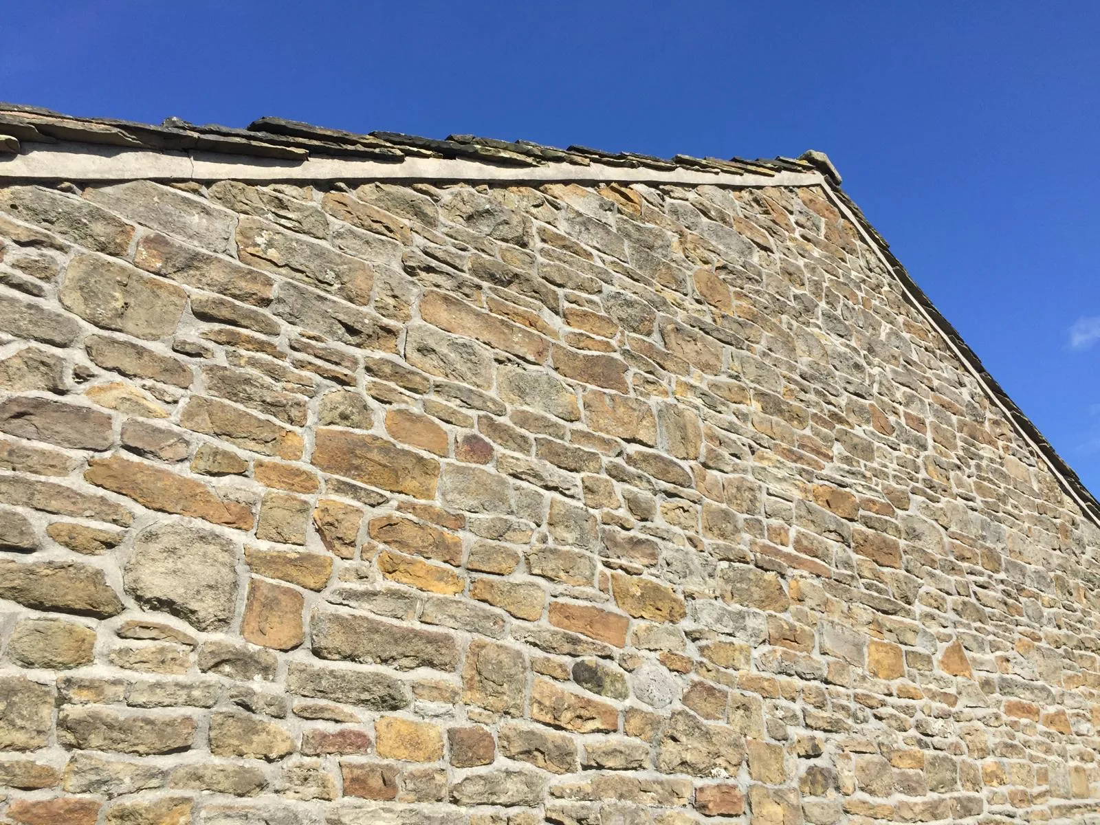 Sandstone gable wall cleaned and protected