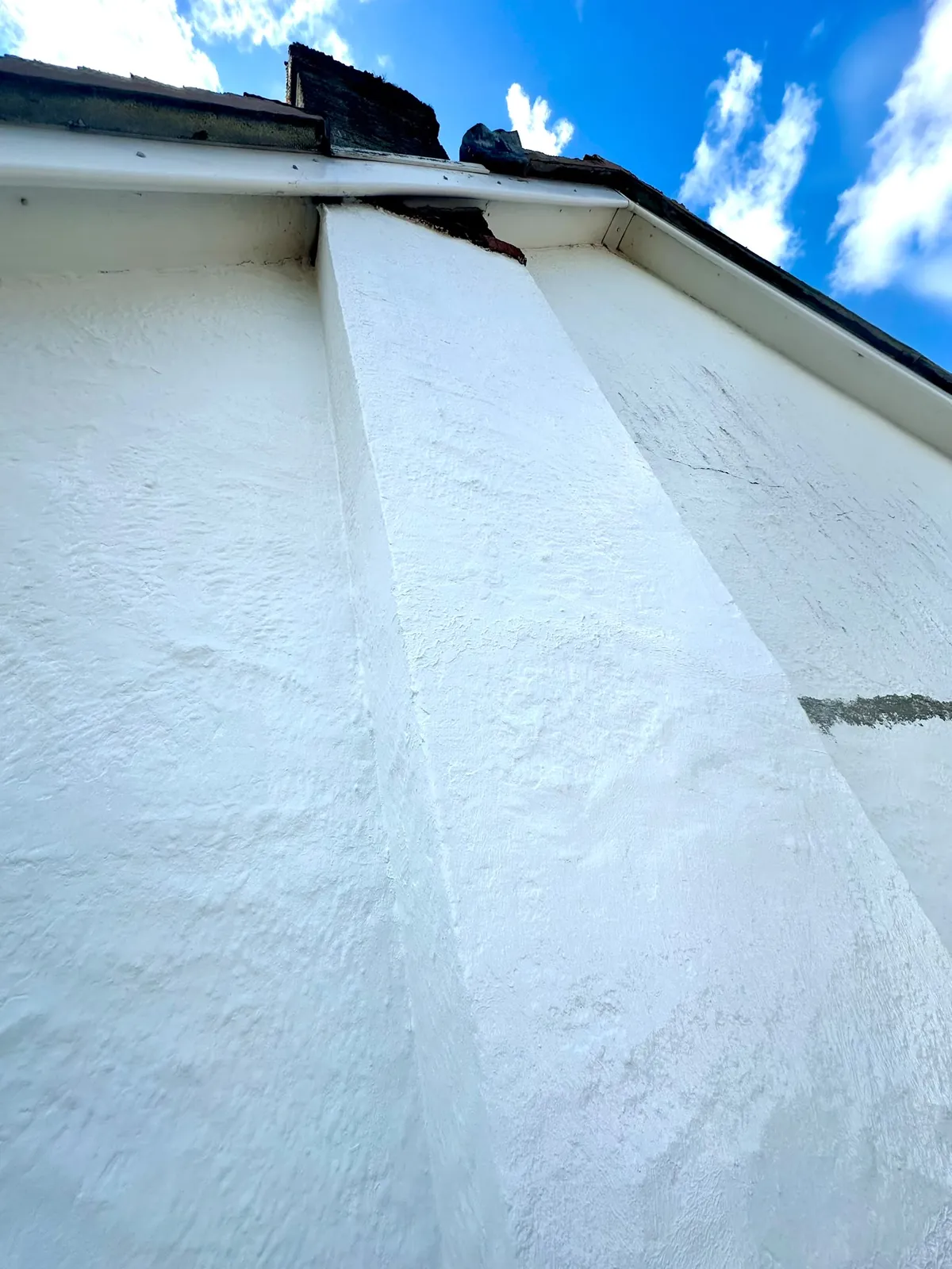 The same gable finished in bright white coating