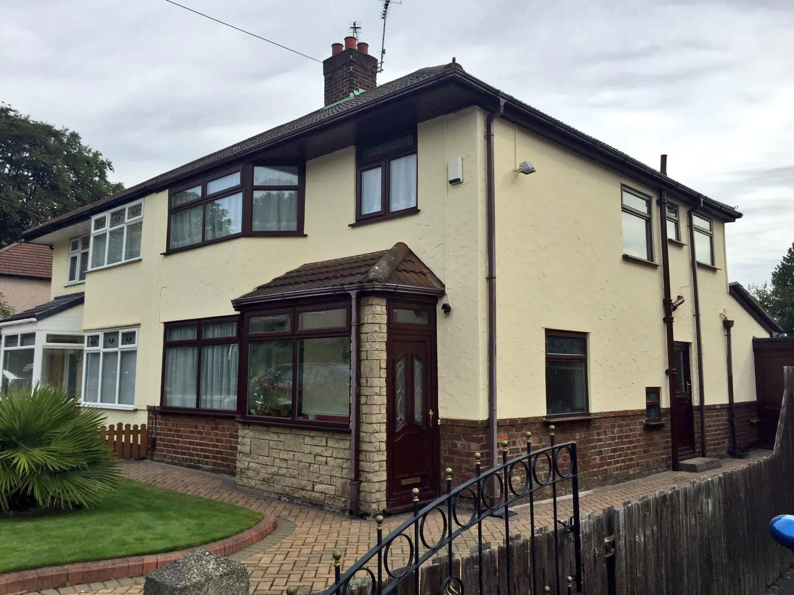 Semi-detached house with completed facade coating