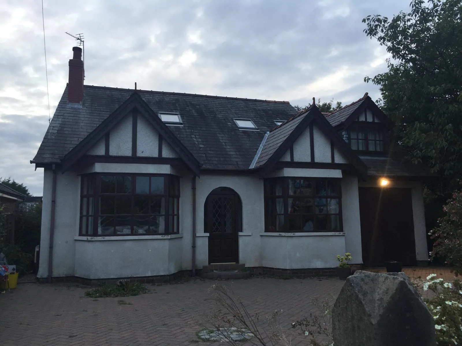 Dormer cottage with tired, dirty render