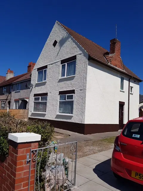 The same property after render repair and coating