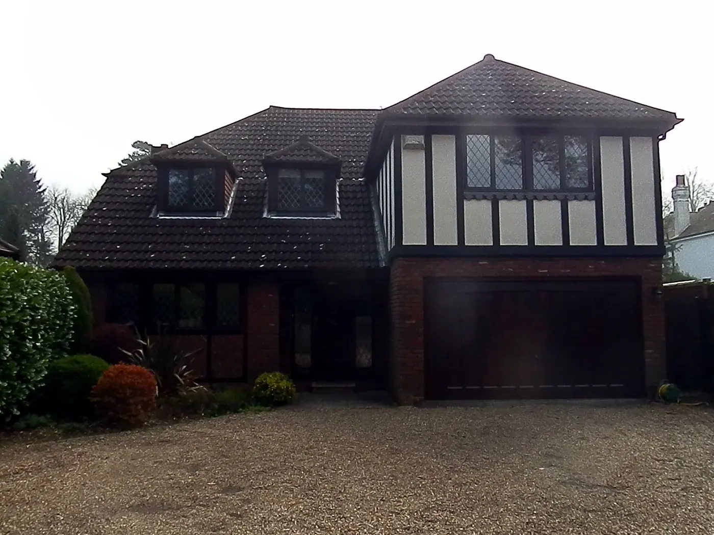A house with a dark, tired roof