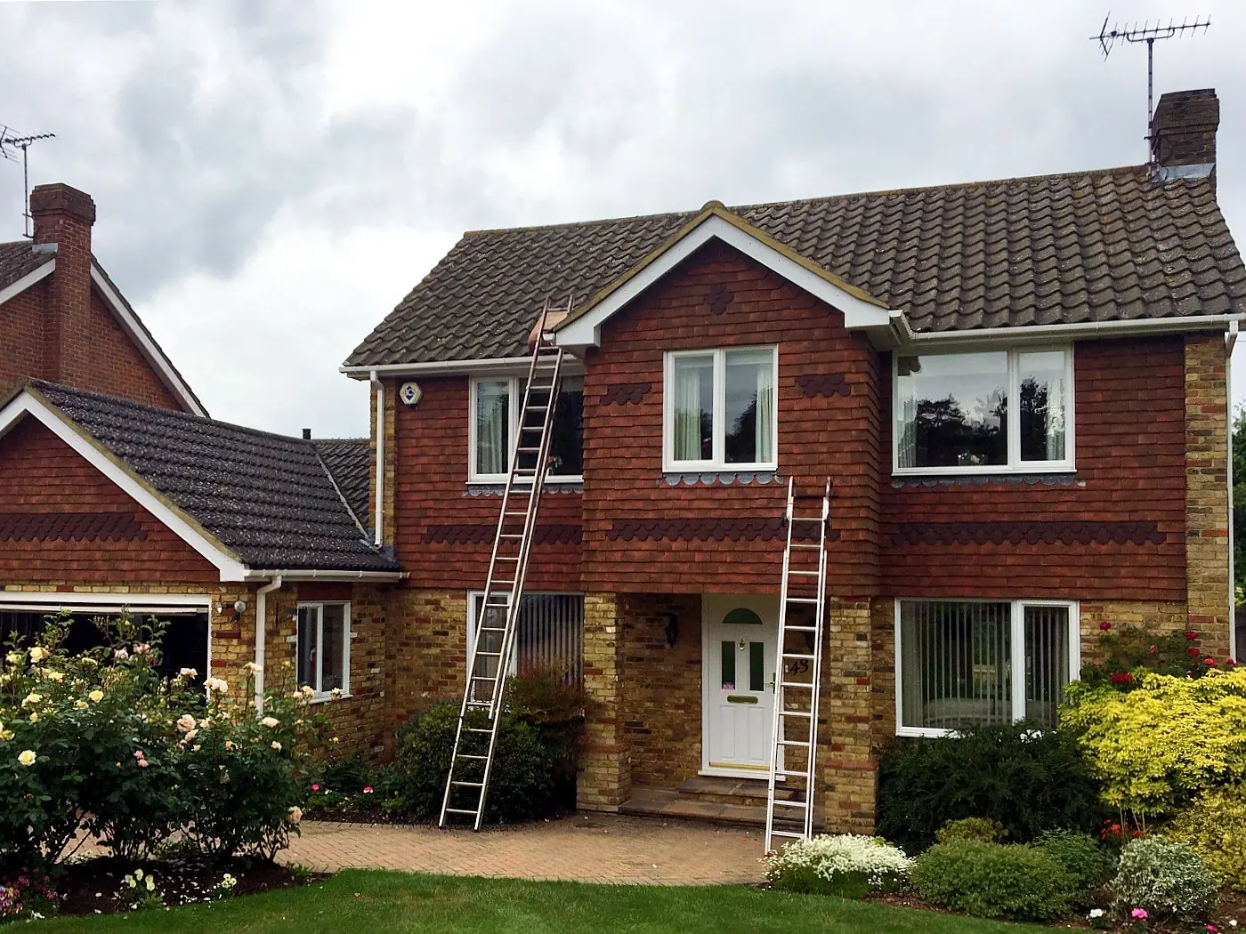 A weathered roof with ladders up
