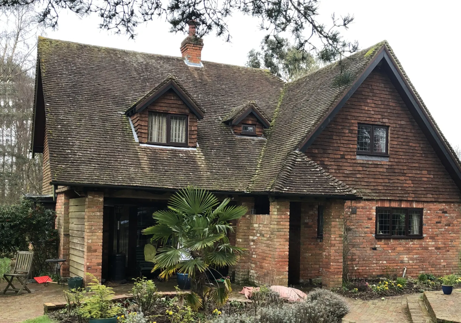 A clay roof green with moss